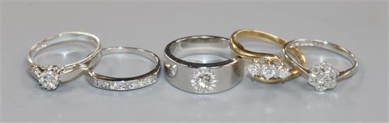Five assorted white and yellow gold diamond set dress rings- 9ct(2) and 18ct(3).